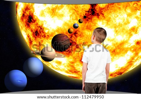boy and the universe (solar system) in window