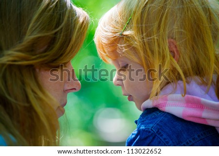 Mother with her daughter outdoors in the park