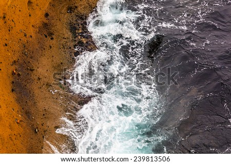Abstract background - wavy sea meets rocks.