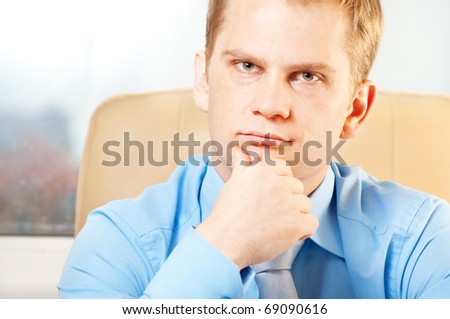 portrait of a young  thoughtful businessman in doubt about somthing