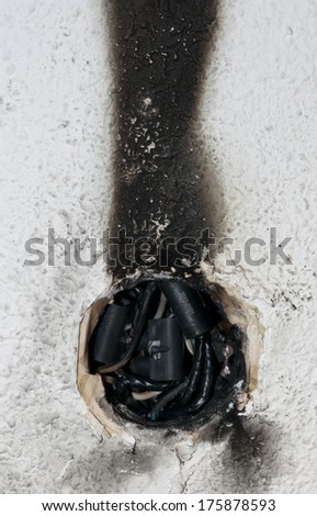 Very dangerous burnt out electrical connection which was in flames and left black smoke up the wall.