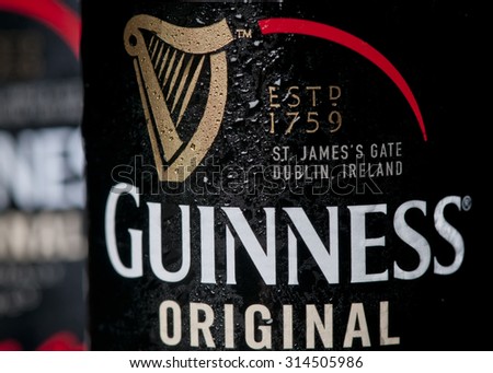 MADRID, SPAIN - September 7, 2015: Close up of a bottle of Guinness original beer,  The breweries in Dublin, Ireland, have a  256 year history and the beer is extremely popular worldwide.
