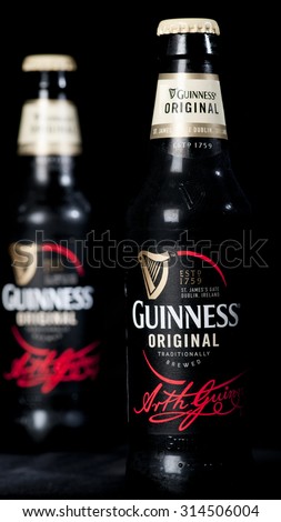 MADRID, SPAIN - September 7, 2015: Close up of two bottles of Guinness original beer,  The breweries in Dublin, Ireland, have a  256 year history and the beer is extremely popular worldwide.
