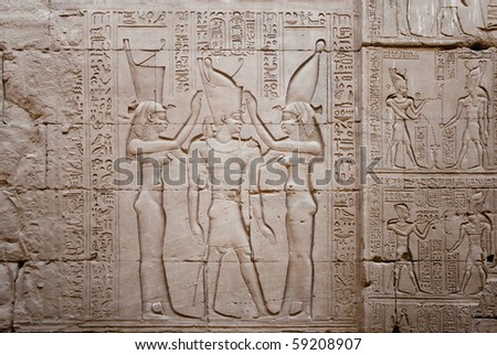 Relief showing the coronation of the pharaoh Ptolemy by the goddess nekhbet on the right and wadjet on the left.  Temple of Horus  (246-221 BC), Edfu on the Nile. Egypt.