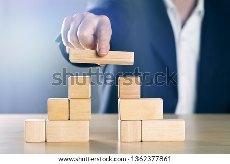 Similar – Image, Stock Photo Businessman with wooden blocks and red arrow