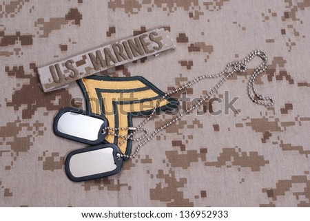 US  Marines concept with service tapes, dog tags and camouflaged uniform