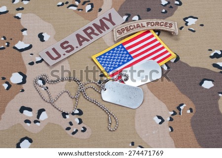 KIEV, UKRAINE - May. 02, US ARMY special forces tab with blank dog tags on camouflage uniform