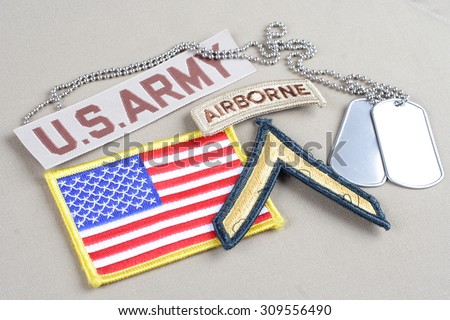 KIEV, UKRAINE - August 21, 2015.  US ARMY Private rank patch, airborne tab, flag patch and dog tag