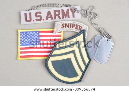 KIEV, UKRAINE - August 21, 2015.  US ARMY Staff Sergeant rank patch, sniper tab, flag patch and dog tag