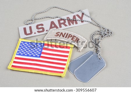 KIEV, UKRAINE - August 21, 2015. US ARMY sniper tab with dog tag and flag patch