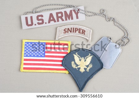 KIEV, UKRAINE - August 21, 2015.  US ARMY Specialist rank patch, sniper tab, flag patch and dog tag