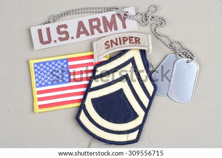 KIEV, UKRAINE - August 21, 2015.  US ARMY Sergeant First Class rank patch, sniper tab, flag patch and dog tag