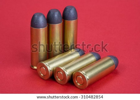 The .45 Revolver cartridges dating to 1872 on red background