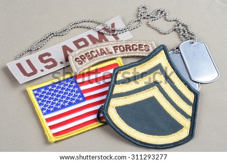 KIEV, UKRAINE - August 21, 2015.  US ARMY Staff Sergeant rank patch, special forces tab, flag patch and dog tag