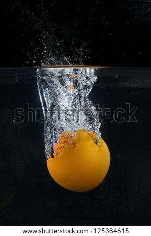 Splash orange on black background