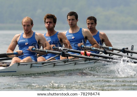 CANDIA, TURIN, ITALY - MAY 22: the CUS Torino quad (quadruple) scull (4x) crew rowing during 2011 Rowing CNU University National Championship on May 22, 2011 on Candia lake, Turin, Italy