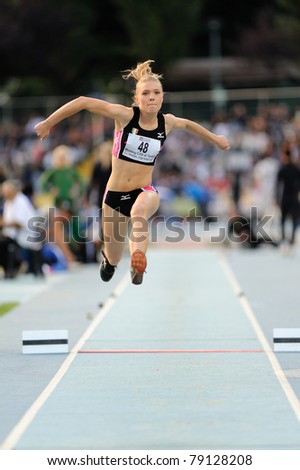 TURIN, ITALY - JUNE 10: Derkac Daria (UKR) performs triple jump during the 2011 Memorial Primo Nebiolo track and field athletics international meeting, on June 10, 2011 in Turin, Italy.