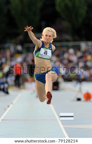 TURIN, ITALY - JUNE 10: Dzetsuk Kseniya (BLR) performs triple jump during the 2011 Memorial Primo Nebiolo track and field athletics international meeting, on June 10, 2011 in Turin, Italy.