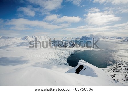 View from the top of mountains - Arctic landscape, glaciers and Arctic Ocean
