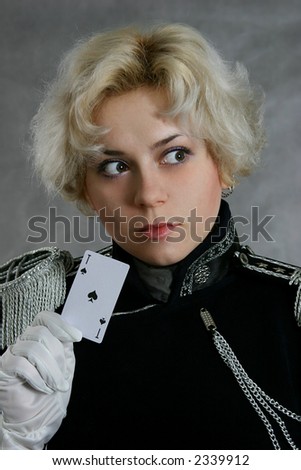 blonde woman in the coat with the ace of spades