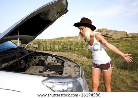 young beauty woman with broken car on the road