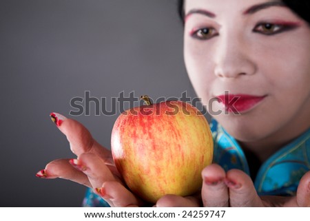 young beauty japanese girl with red apple