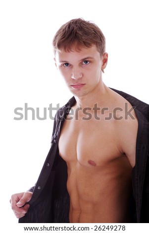 Man holding shirt and showing good figure