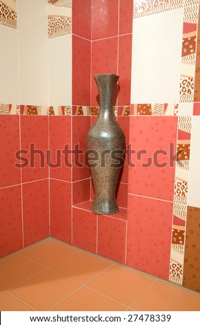 modern interior with bronze vase and colored ceramics