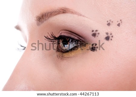 woman\'s eye with cat footprint on face