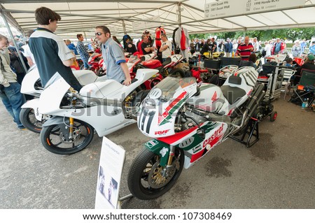 GOODWOOD, UK - JULY 1: Classic Honda and Ducati racing bikes in the service pits at the Festival of Speed motor-sport event held at Goodwood, UK on July 1, 2012