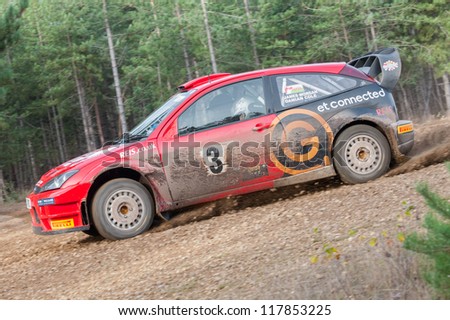 BRAMSHILL FOREST, UK - NOVEMBER 3, 2012: Damian Cole driving a WRC spec Ford Focus on the Warren stage of the MSA Tempest Rally in Bramshill Forest, UK on November 3, 2012