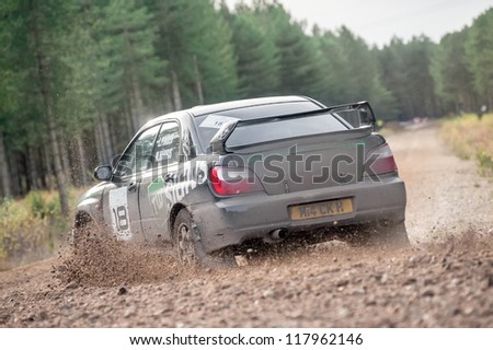 BRAMSHILL FOREST, UK - NOVEMBER 3, 2012: Over-steer by Mike Harris driving a Subaru Impreza on the Warren stage of the MSA Tempest Rally in Bramshill Forest, UK on November 3, 2012