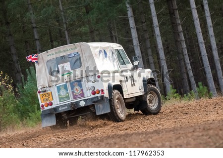 BRAMSHILL FOREST, UK - NOVEMBER 3, 2012: RAF military team driver Steve Partridge in a Land Rover Wolf on the Warren stage of the MSA Tempest Rally in Bramshill Forest, UK on November 3, 2012