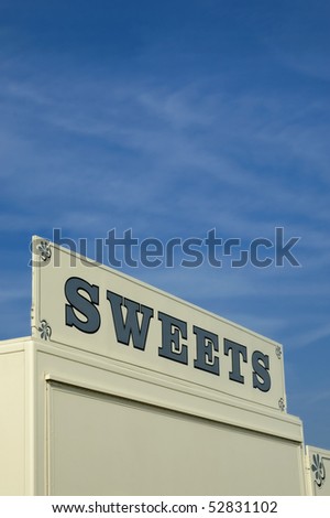 vendor booth for selling sweets against blue sky