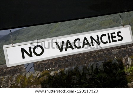 No Vacancies Sign outside Hotel in Rural Setting