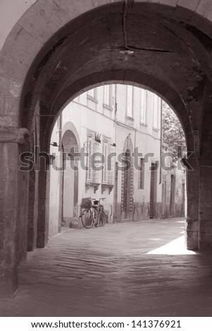 Street Scene in Lucca with Bicycle, Tuscany, Italy in Black and White Sepia Tone
