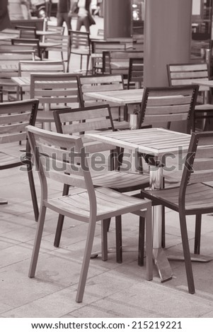 Cafe Table and Chairs in Urban Setting in Black and White Sepia Tone