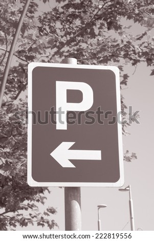 Parking Sign in Urban Setting in Black and White Sepia Tone
