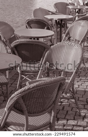 Cafe Table and Chairs in Summer Sun in Black and White Sepia Tone