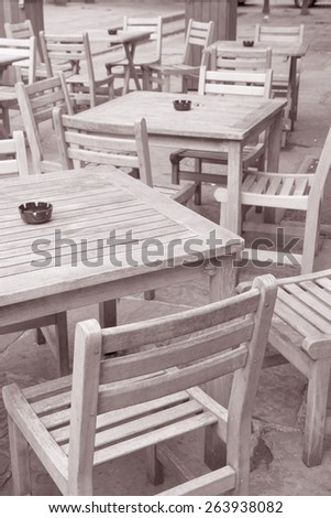 Cafe Table and Chairs in Manchester, England, UK in Black and White Sepia Tone