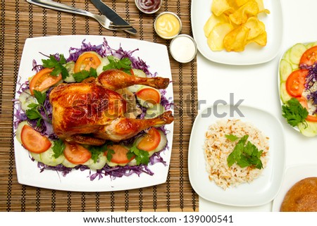 Charcoal baked chicken and side dishes