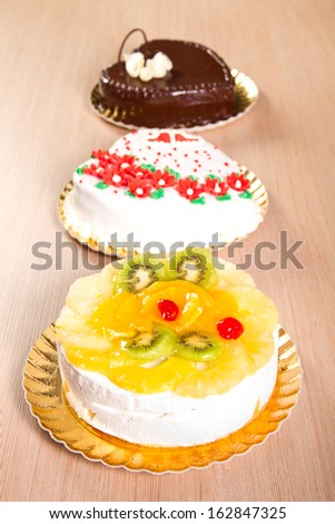 Three types of cakes on platters