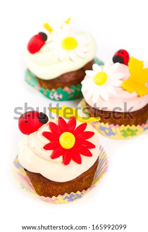 Three cupcakes on white background