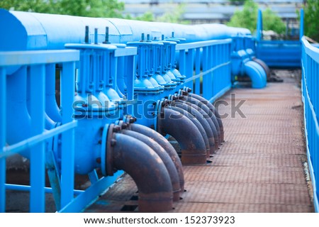 Many blue gas pipelines with stop-gate valves at industrial plant