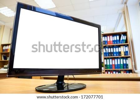 Monitor screen with white isolated background is on desk