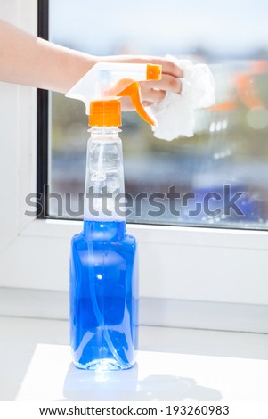 Plastic bottle of cleaning liquid with spray for window washing