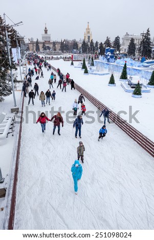 MOSCOW, RUSSIA - CIRCA JAN, 2015: People are on main city skating rink in Moscow VDNKh area. VDNKh is the all-Russian Exhibition Center with huge skating ring at winter season