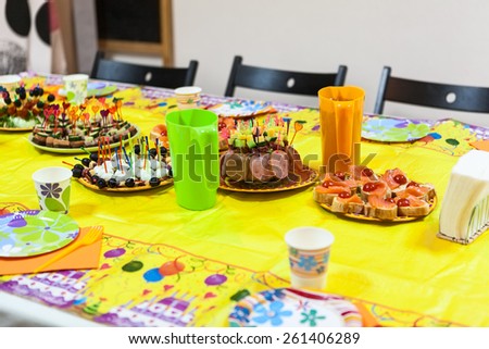 Holiday table with snacks, children birthday or party celebration