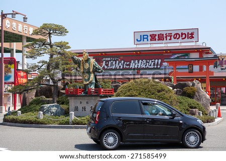 MIYAJIMAGUCHI, JAPAN - CIRCA APR, 2013: Sculpture is in front of building of JR transport company sea station for ferry departure to the island of Miyajima (Itsukusimi). The Miyajimaguchi town