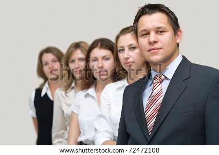 Business a team of five people with the man the leader at the head. On a white background. One man and four woman